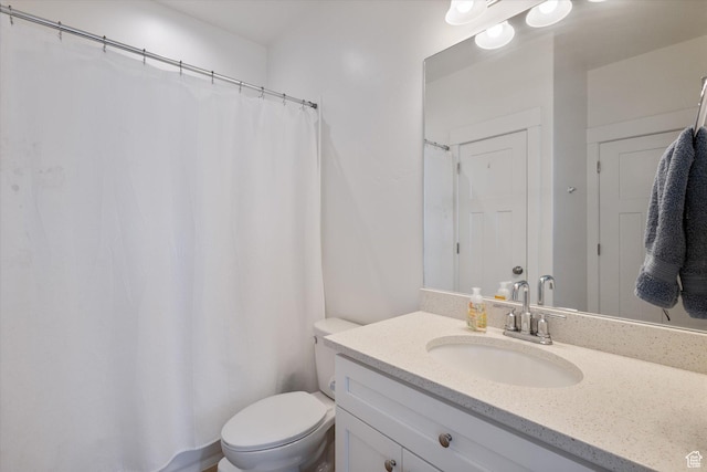 full bath featuring toilet and vanity