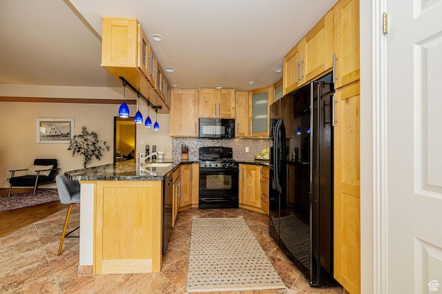 2356 E 3900 S, Millcreek, UT 84124 - kitchen with black appliances, a peninsula, a breakfast bar area, decorative backsplash, and glass insert cabinets