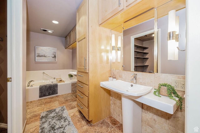 2356 E 3900 S, Millcreek, UT 84124 - bathroom with a garden tub and tasteful backsplash