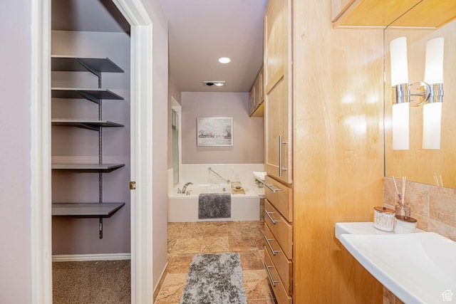 2356 E 3900 S, Millcreek, UT 84124 - bathroom featuring a bath and stone finish floors