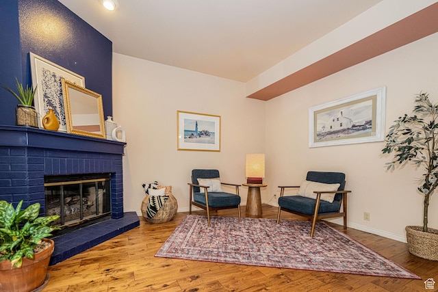 2356 E 3900 S, Millcreek, UT 84124 - sitting room featuring wood finished floors and a brick fireplace