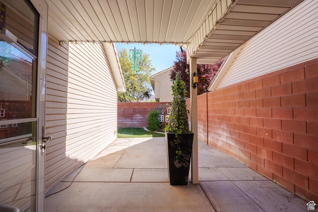 view of patio featuring fence