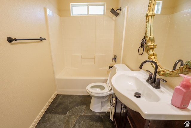 full bath with bathing tub / shower combination, baseboards, vanity, and toilet