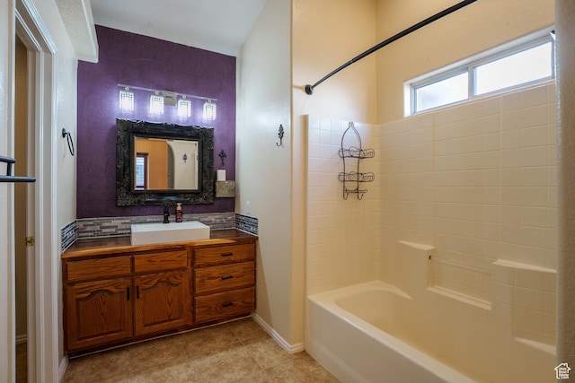 bathroom with tile patterned floors, washtub / shower combination, vanity, and tasteful backsplash