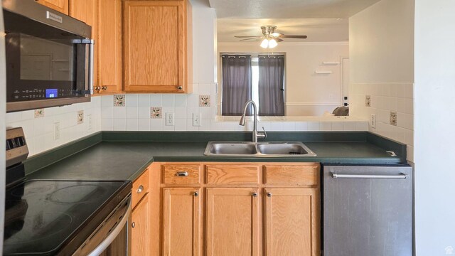 1397 W Archmore Dr, Springville, UT 84663 - kitchen featuring ornamental molding, dark countertops, ceiling fan, stainless steel appliances, and a sink