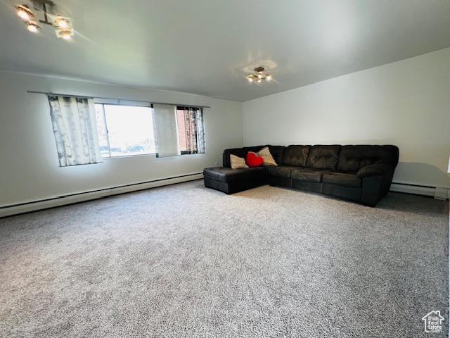 living room featuring carpet and baseboard heating