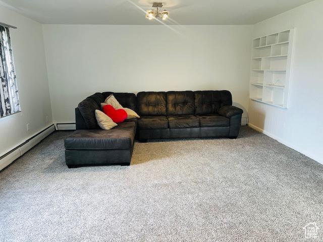 carpeted living area with built in shelves