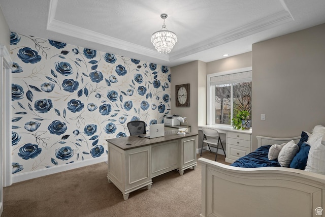 office area featuring a tray ceiling, light carpet, a notable chandelier, and ornamental molding