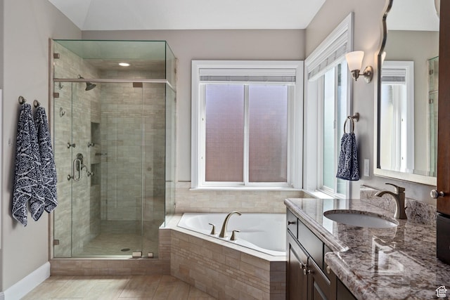 full bath with baseboards, a shower stall, vanity, tile patterned flooring, and a garden tub