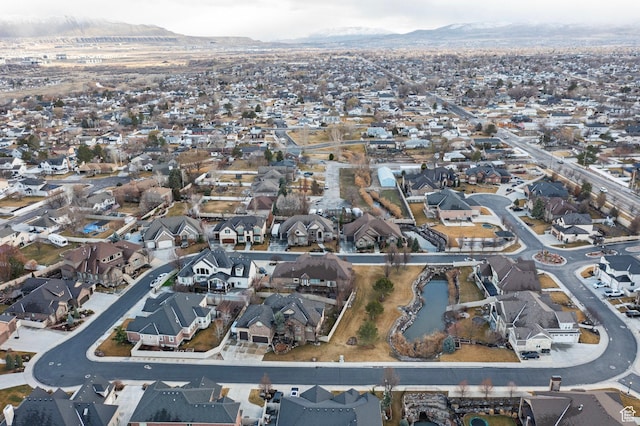 birds eye view of property with a mountain view and a residential view