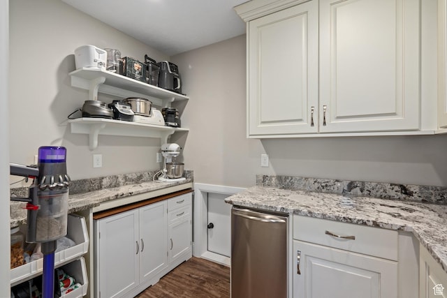 kitchen featuring white cabinets, light stone countertops, dark wood-type flooring, and open shelves