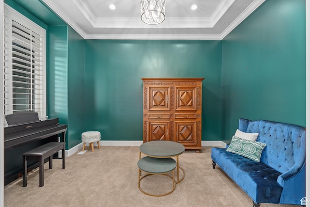 living area featuring a tray ceiling, crown molding, and carpet floors