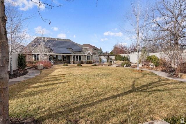 view of yard featuring fence, covered porch, and central air condition unit