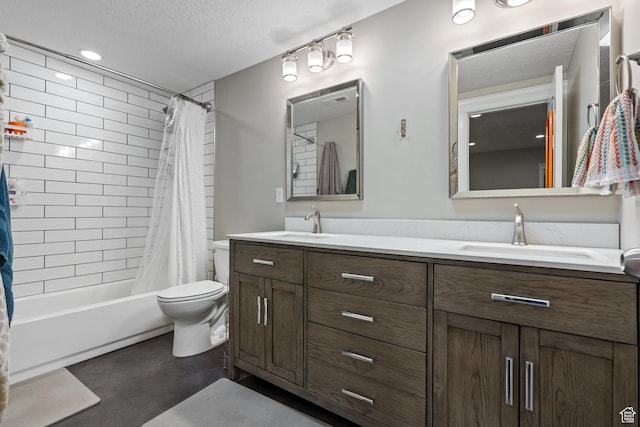 full bath featuring shower / bath combo, double vanity, a sink, and toilet