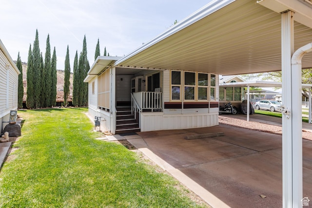 1160 E Telegraph St S Unit 32, Washington, UT 84780 - exterior space with a carport and a lawn