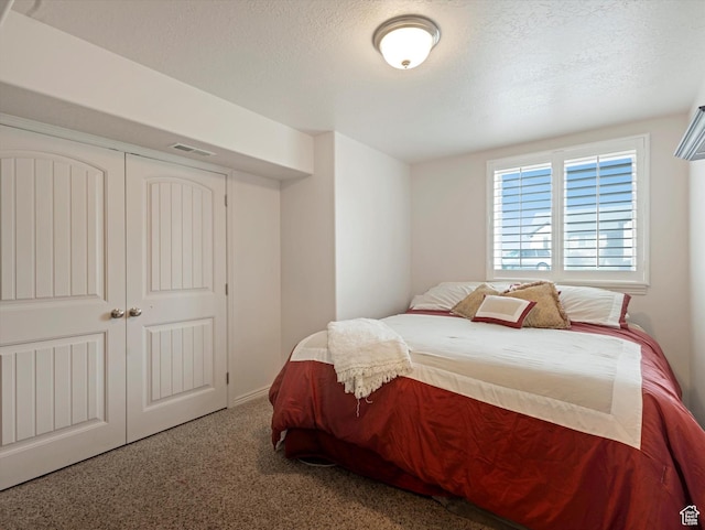 3057 N 3325 W, Plain City, UT 84404 - carpeted bedroom with a closet, visible vents, and a textured ceiling