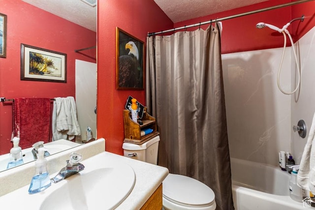 full bathroom featuring toilet, vanity, a textured ceiling, and shower / bathtub combination with curtain