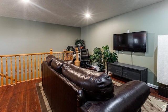 living room with baseboards, wood finished floors, and recessed lighting