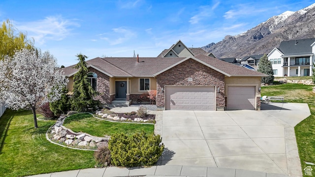 single story home with driveway, stone siding, a front yard, a mountain view, and a garage