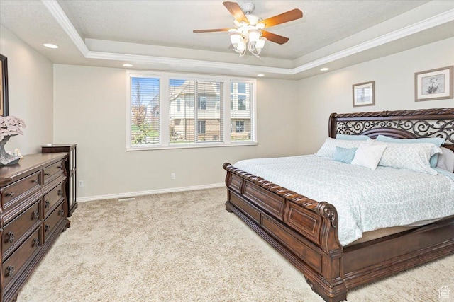 bedroom featuring recessed lighting, a raised ceiling, ornamental molding, baseboards, and light colored carpet