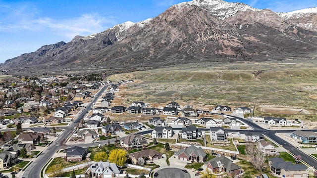 birds eye view of property with a mountain view and a residential view