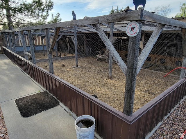 view of yard featuring exterior structure and an outdoor structure