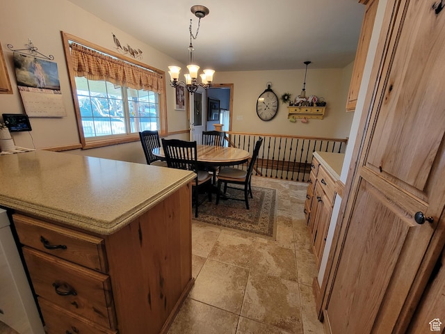 dining space featuring stone finish flooring and a chandelier