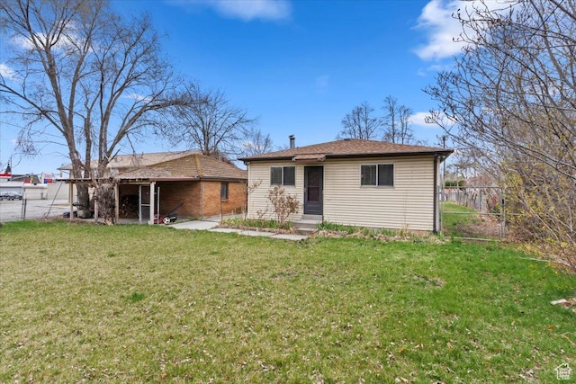 148 N 100 E, American Fork, UT 84003 - back of property with entry steps, fence, and a lawn