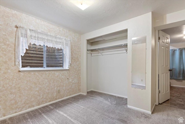 148 N 100 E, American Fork, UT 84003 - unfurnished bedroom featuring a textured ceiling, a closet, carpet floors, wallpapered walls, and baseboards
