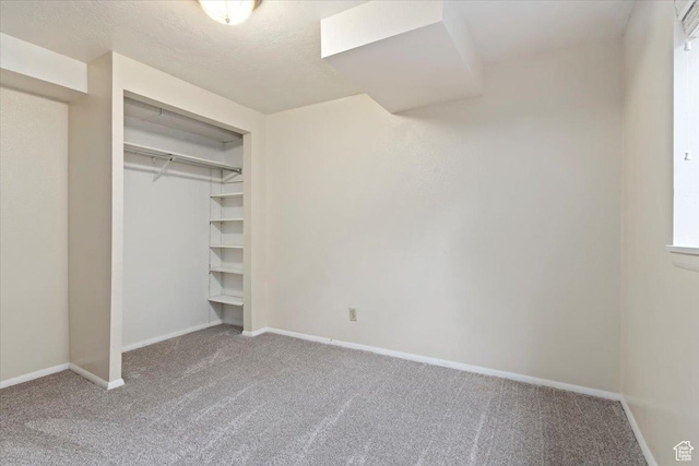 148 N 100 E, American Fork, UT 84003 - unfurnished bedroom with a textured ceiling, a closet, baseboards, and carpet
