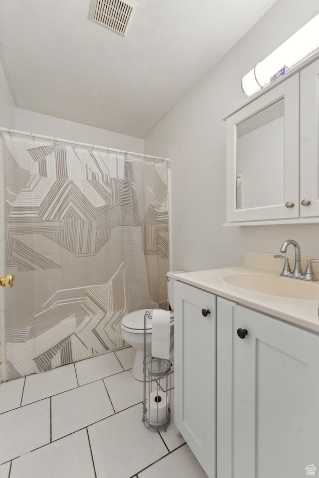 1601 W 400 S Unit 26, Salt Lake City, UT 84104 - bathroom with vanity, visible vents, toilet, a shower with shower curtain, and tile patterned floors