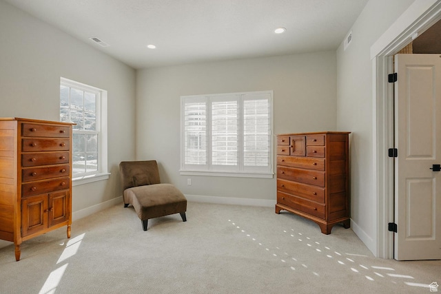sitting room with visible vents, baseboards, recessed lighting, and carpet