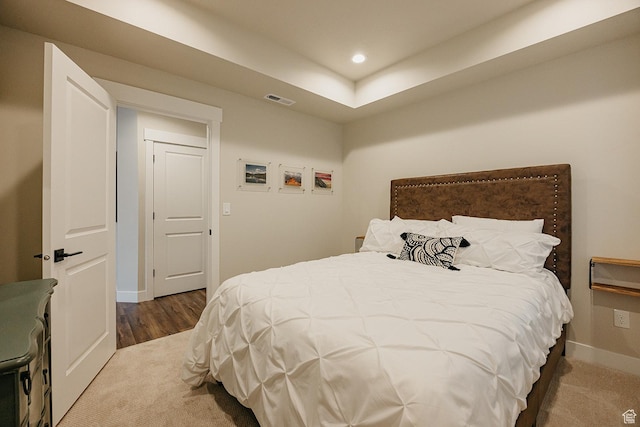 carpeted bedroom with baseboards, visible vents, and recessed lighting