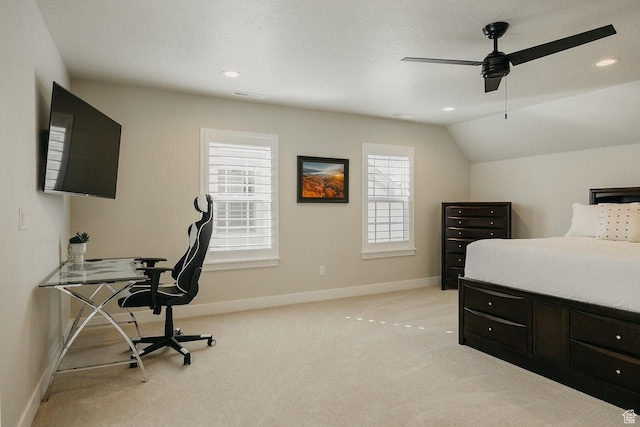 bedroom featuring ceiling fan, light colored carpet, visible vents, lofted ceiling, and baseboards