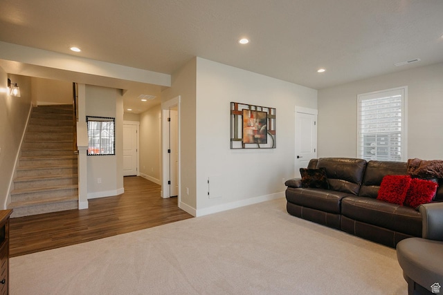 living room with baseboards, stairway, carpet flooring, and recessed lighting
