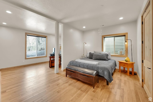 10802 E Green Briar Rd Unit 562, Heber City, UT 84032 - bedroom featuring light wood-type flooring, multiple windows, and recessed lighting