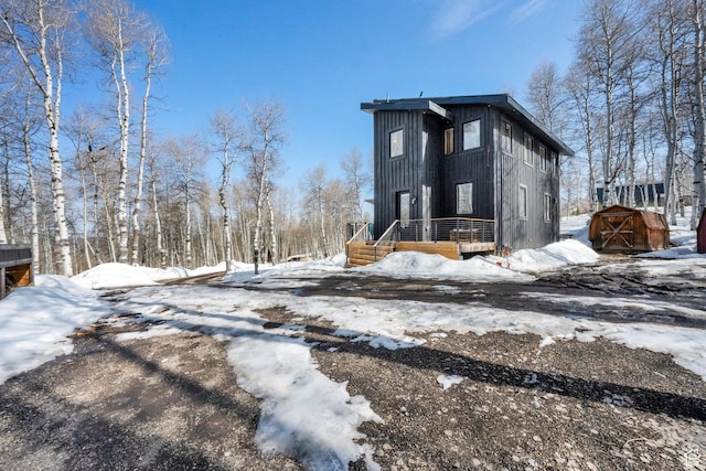 10802 E Green Briar Rd Unit 562, Heber City, UT 84032 - view of snowy exterior featuring an outbuilding and a storage unit