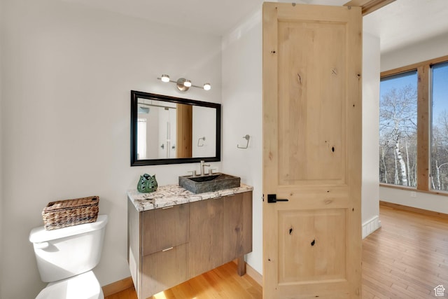 10802 E Green Briar Rd Unit 562, Heber City, UT 84032 - bathroom with baseboards, toilet, and wood finished floors