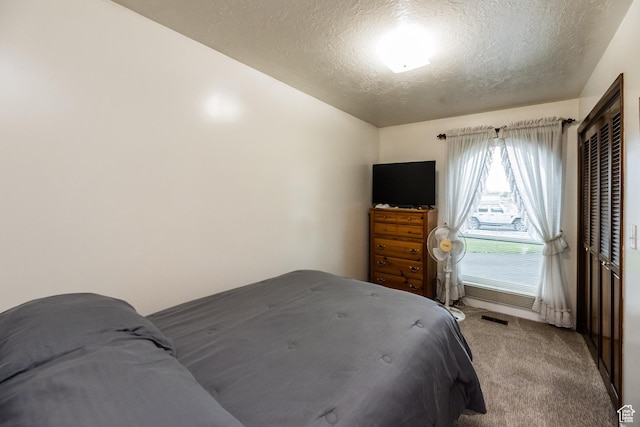 314 W 100 S, Providence, UT 84332 - bedroom featuring a textured ceiling, a closet, light colored carpet, and visible vents