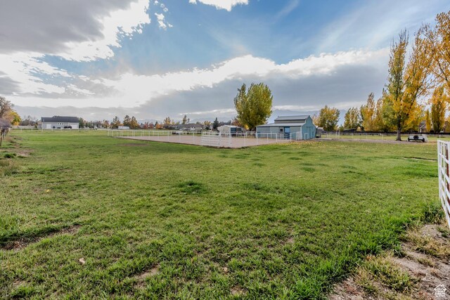314 W 100 S, Providence, UT 84332 - view of yard with an outdoor structure, fence, an enclosed area, and a rural view