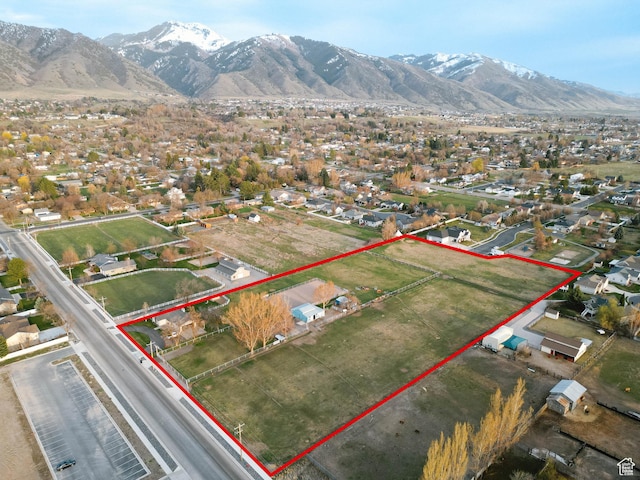 aerial view featuring a mountain view and a residential view