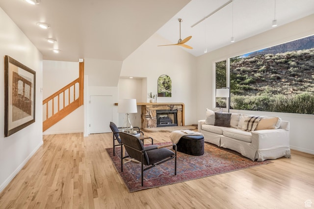 282 Valley View Dr, Springdale, UT 84767 - living room featuring wood finished floors, baseboards, a ceiling fan, and stairs