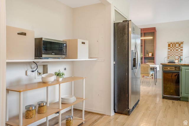 282 Valley View Dr, Springdale, UT 84767 - kitchen with green cabinets, light wood-style flooring, and appliances with stainless steel finishes
