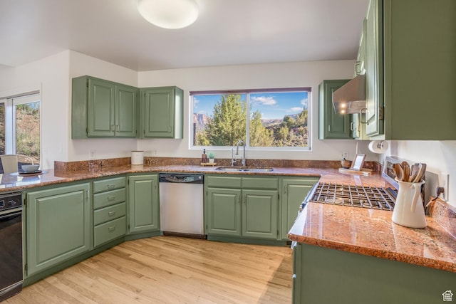 282 Valley View Dr, Springdale, UT 84767 - kitchen with dishwasher, a sink, light wood finished floors, light stone counters, and extractor fan