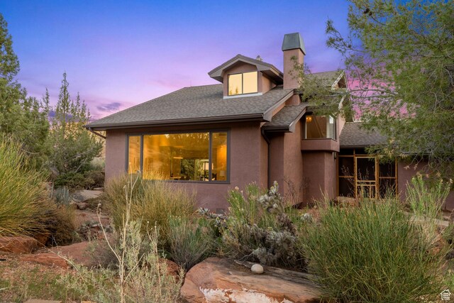 282 Valley View Dr, Springdale, UT 84767 - view of front of home with a chimney, a shingled roof, and stucco siding