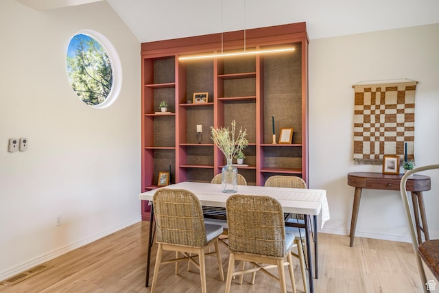 282 Valley View Dr, Springdale, UT 84767 - dining space with visible vents, baseboards, vaulted ceiling, and light wood-style flooring