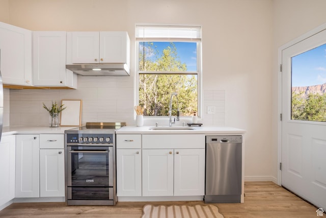 282 Valley View Dr, Springdale, UT 84767 - kitchen featuring a sink, light countertops, appliances with stainless steel finishes, and under cabinet range hood