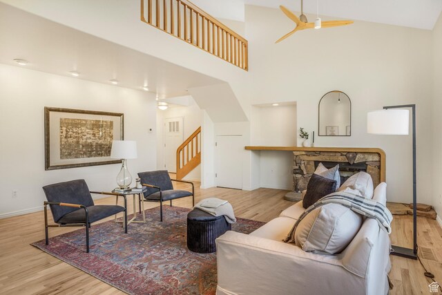 282 Valley View Dr, Springdale, UT 84767 - living room with baseboards, a high ceiling, ceiling fan, wood finished floors, and stairs