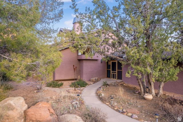 282 Valley View Dr, Springdale, UT 84767 - view of front of property with a chimney and stucco siding