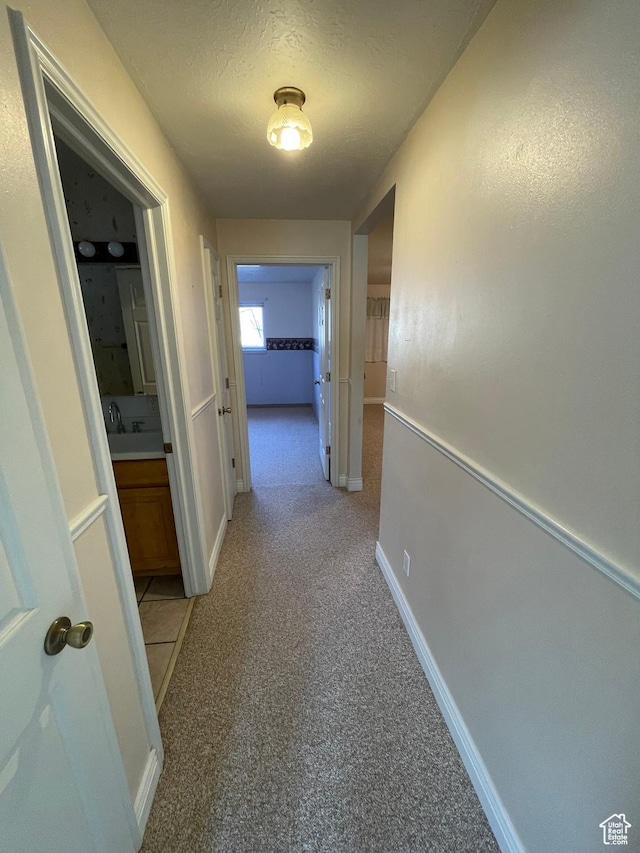 848 N 500 W, Malad City, ID 83252 - hallway with baseboards and a textured ceiling